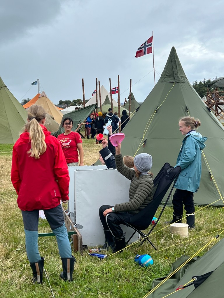 Scouts at camp, busy with market day activities.